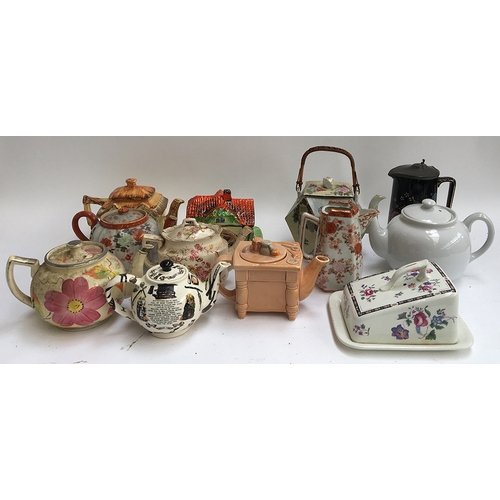 120 - A lot of various teapots, some novelty, several butter dishes, etc, to include Cardew, Arthur Wood, ... 