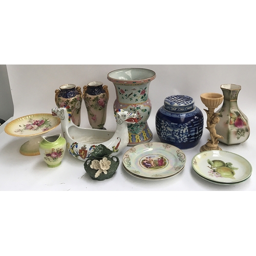 131 - A mixed lot of vases and ceramics to include an oriental drum vase and a blue and white ginger jar