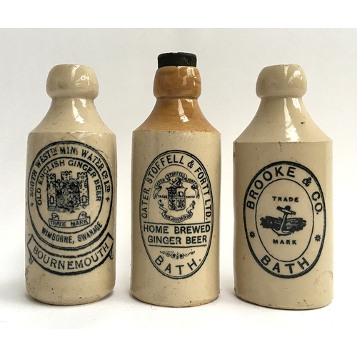 72A - Three stoneware ginger beer bottles: 'Old English Ginger Beer, Wimborne, Swanage, Bournemouth'; 'Hom... 