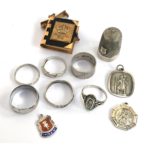 20 - Six silver rings, two silver St Christophers, silver thimble, etc