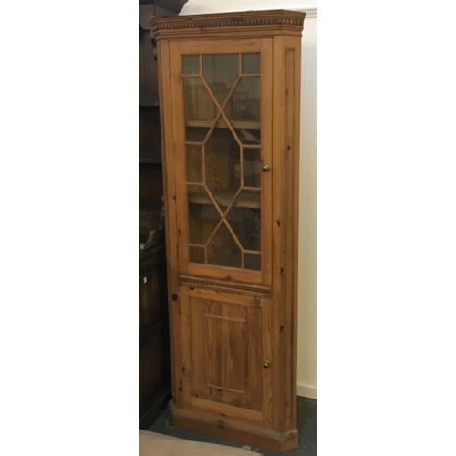 840 - A pine cabinet with astragal glazing over cupboard door, 190cmH