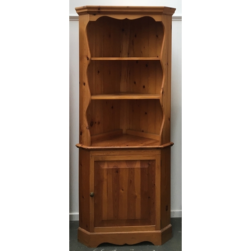 841 - A pine cabinet, shelves above cupboard, 200cmH