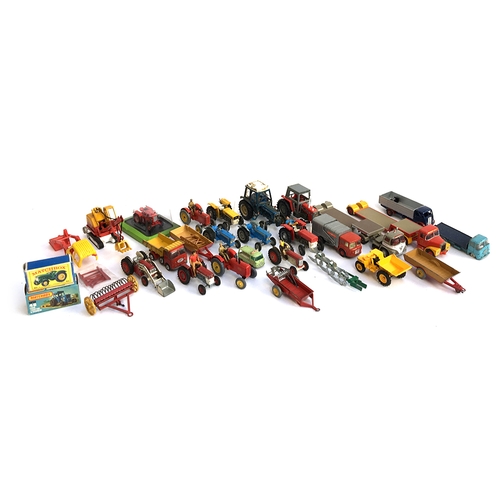 940 - A large quantity of model tractors and other vehicles, to include Dinky and Britains, including a Ma... 