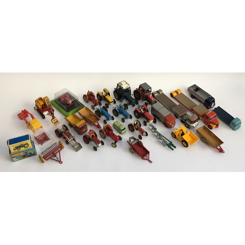 940 - A large quantity of model tractors and other vehicles, to include Dinky and Britains, including a Ma... 