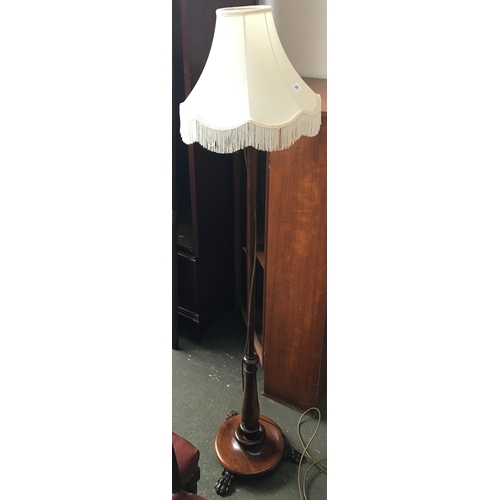 848 - An attractive standard lamp with turned base on paw feet, 150cmH