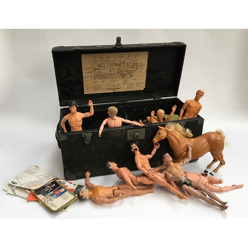 1069 - A wooden box filled with a quantity of Action Man figures; together with a small plastic chest fille... 