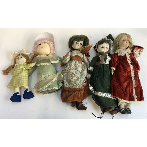 1018 - Three porcelain dolls and three rag dolls