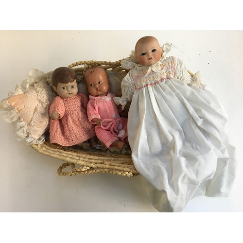 1030 - A small 20th century doll with ceramic head, marked 'Rachel Karslake 1985'; together with two other ... 