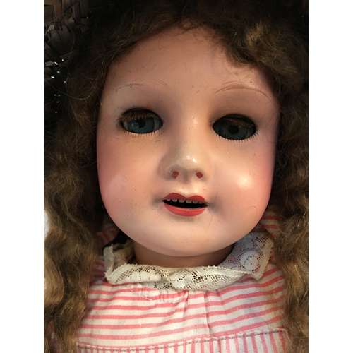 1031 - A French SFBJ 301 doll with blue sleeping eyes in pinstripe dress