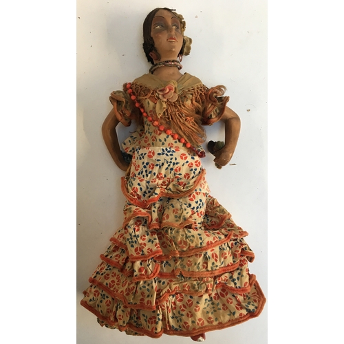 1032 - A vintage Spanish flamenco doll, composition body with hand painted detail and stencilled fishnet ti... 