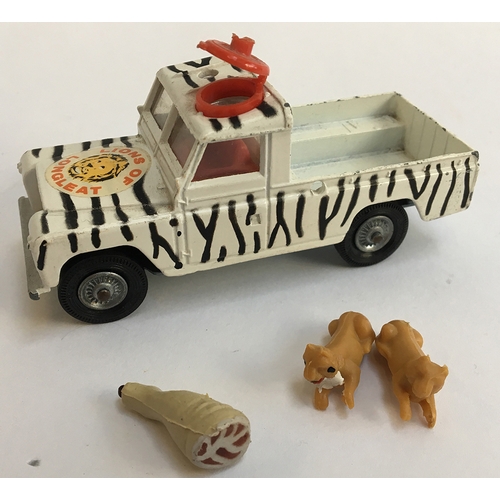 959 - A vintage Corgi ltd 'Lions of Longleat' land rover, together with two lions and a leg of meat