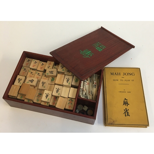 1051 - A 20th century Chinese Mahjong set in wooden hardwood box with approximately 148 bamboo game pieces;... 