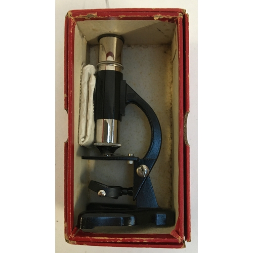 1078 - A vintage children's microscope, with two slides, in original box