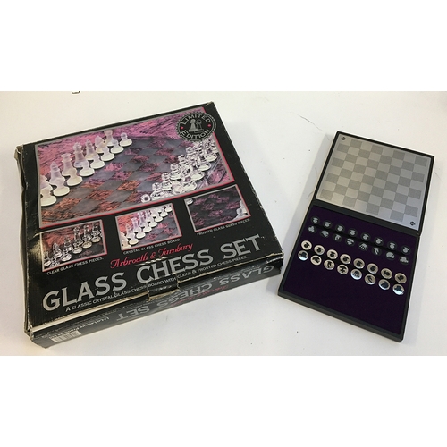 1081 - An Arbroath & Turnbury limited edition glass chess set; together with a Jeff Banks magnetic travel c... 