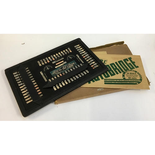 1088 - A vintage 'Duo-Bridge' autobridge playing board, with two unopened packets of group E and F playing ... 