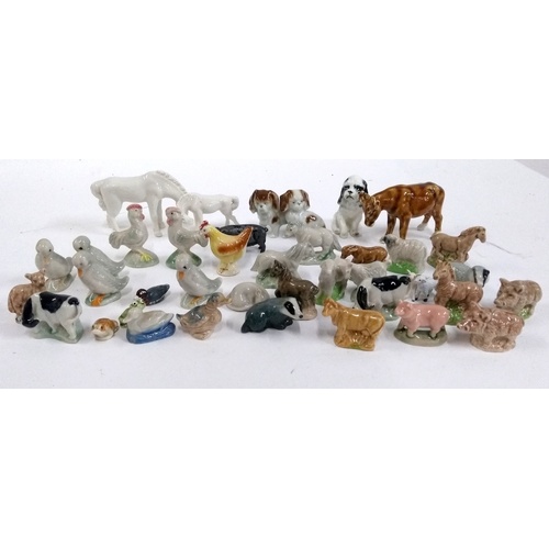 133 - A collection of Wade and other whimsies, mainly farm animals, to include a goat, chicken, cow, horse... 