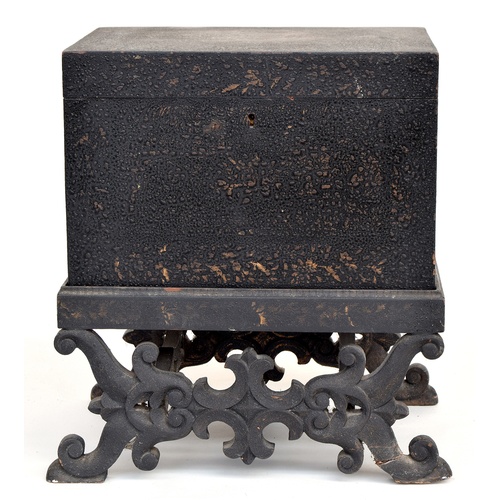 572 - A Chinese coffer with hinged lid, on carved stand, with carved stretchers