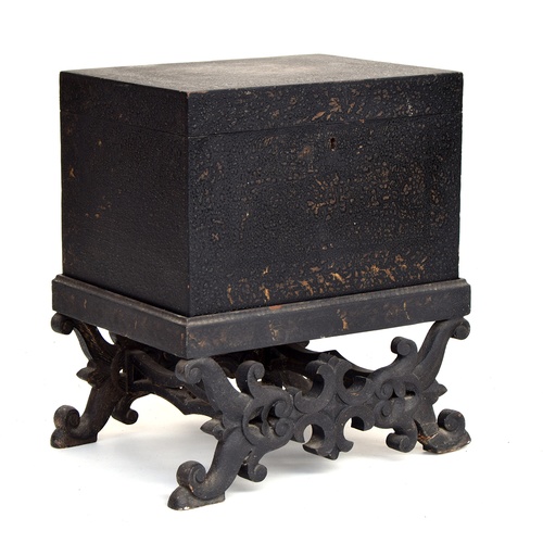 572 - A Chinese coffer with hinged lid, on carved stand, with carved stretchers