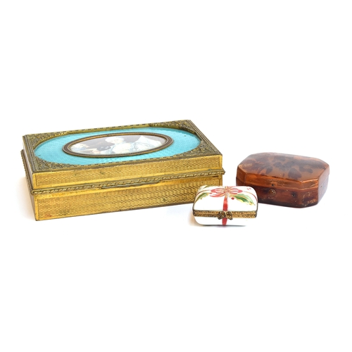 116 - A tortoiseshell trinket box with hinged lid, together with a guilloche enamel and gilt metal cigaret... 