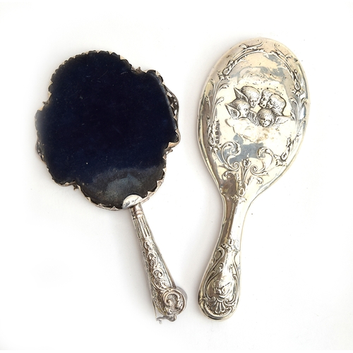 78 - Two Victorian silver dressing hand mirrors: one by Henry Matthews, Birmingham 1898, bevelled oval pl... 