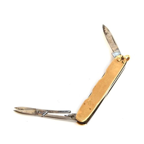 113 - A 14ct gold bound folding pocket knife, with small steel blade and pair of scissors, 6.7cm long