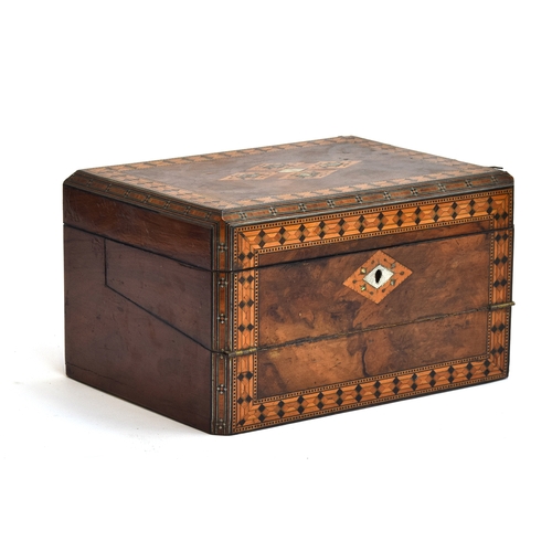 121 - A 19th century parquetry writing box, having fitted interior with inkwell and pen rest, the slope wi... 