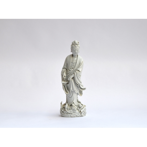 157 - A Chinese blanc de Chine porcelain figure of Guanyin, the Bodhisattva of Compassion (af), 36.5cm hig... 