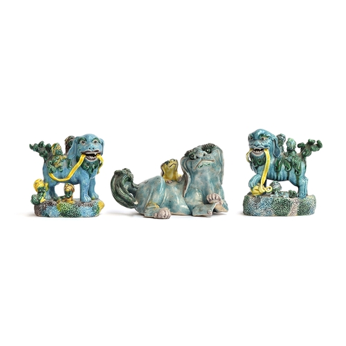 168 - A set of three glazed polychrome porcelain foo dogs (af), two of which 9.5cm high, the other 8cm hig... 