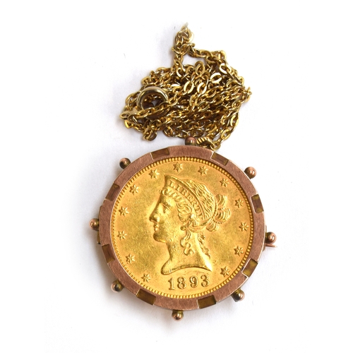 92 - 1893 gold 10 dollar coin in 9ct gold holder and yellow metal chain