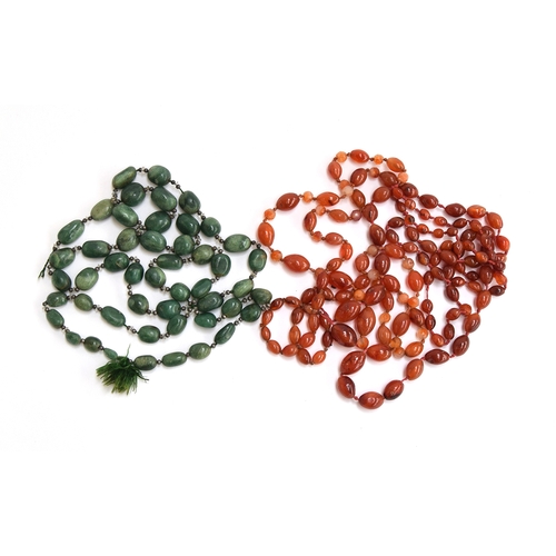 94 - A string of hardstone beads together with a further set of green agate stones (both need re-stringin... 