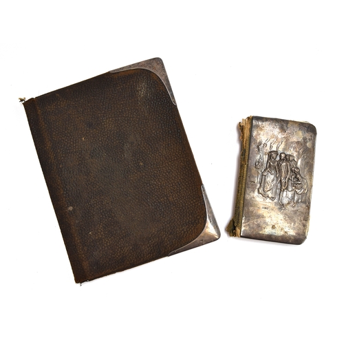 80 - A silver repousse address book, marked William Comyns & Sons, London, 1905; together with a small le... 