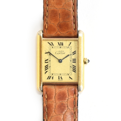 105 - A Must de Cartier silver gilt ladies tank wristwatch
Blued hands, black Arabic numerals, cream dial,... 