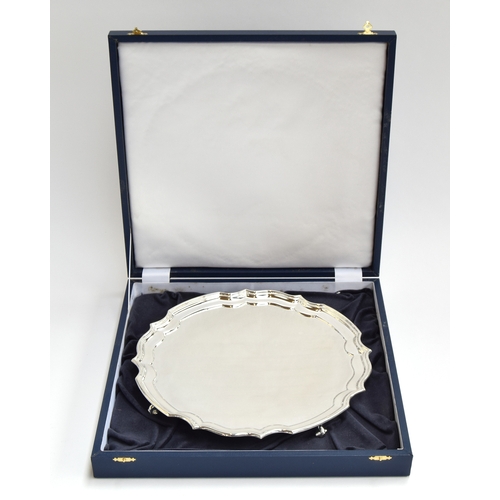 63 - A modern silver salver on four scrolling feet, Sheffield 2015, 30cm diameter, 28.5oz