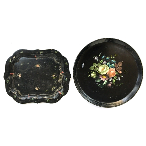 125 - Two 19th century papier mache trays, one 48cm diameter, the other 48cm long, 38.5cm wide