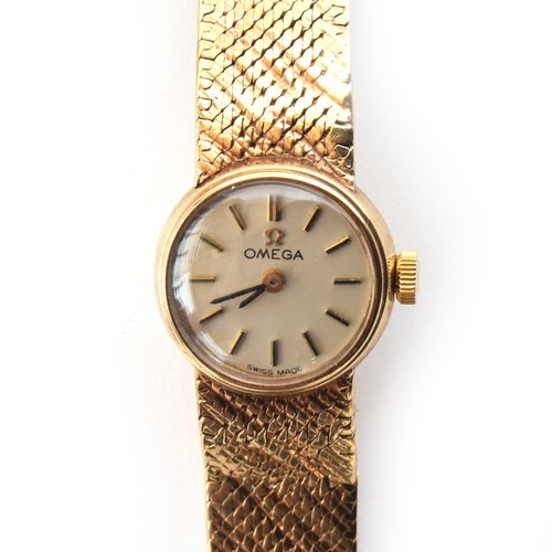 105A - An Omega 9ct gold ladies cocktail watch, integral mesh bracelet, the silvered dial with baton hour m... 