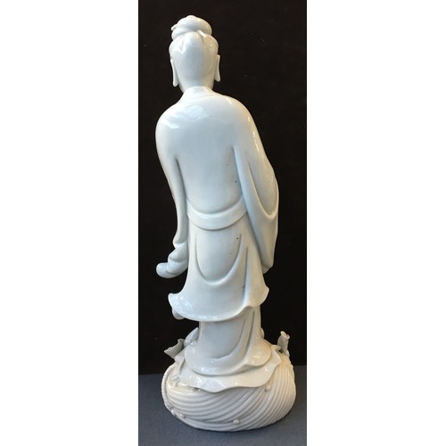 157 - A Chinese blanc de Chine porcelain figure of Guanyin, the Bodhisattva of Compassion (af), 36.5cm hig... 