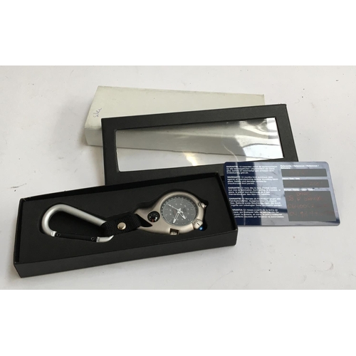 42 - A Davis Micro Light clip watch, in silver, with presentation box and guarantee