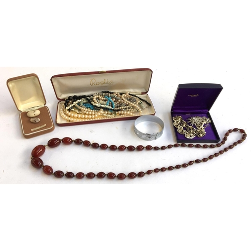 12 - Mixed lot of costume jewellery to include pearl necklace, amber style beads, other beads, brooch and... 