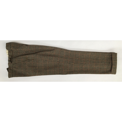 593 - A gent's three piece tweed suit, tailored by Moss Bros., 1983, the jacket with double vent to rear a... 