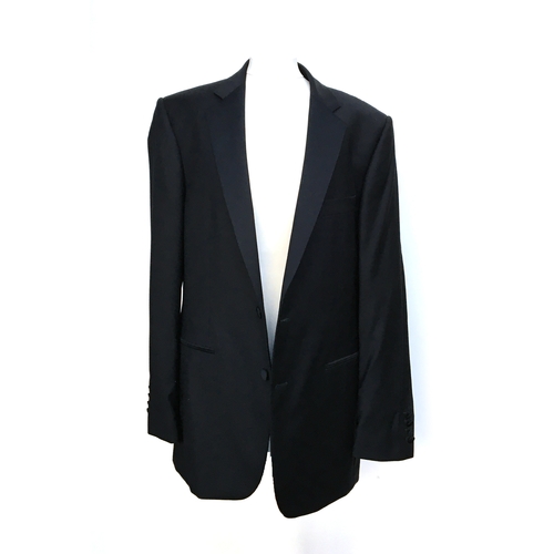 595 - A gent's black tie wool dinner jacket and trousers, single breasted with two buttons, by Gieves & Ha... 