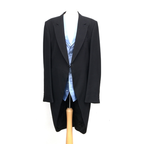 597 - A morning suit, comprising Moss Bros. wool jacket, Hackett blue silk single breasted waistcoat, with... 