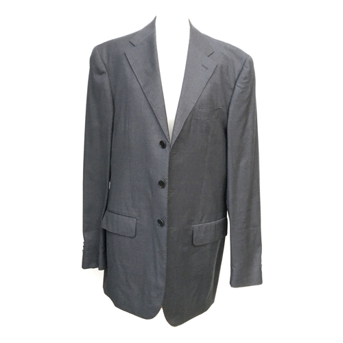 599 - A gent's grey single breasted wool suit by John Bray, the trousers with pleated tops and turnups, 31... 