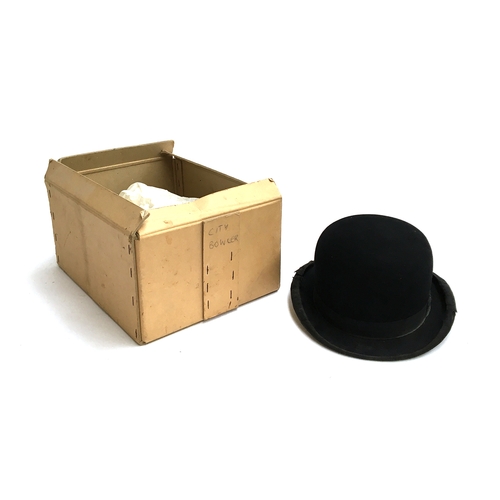 554 - A Thomas & Stone, London, black bowler hat, size 7 1/4, in box without lid