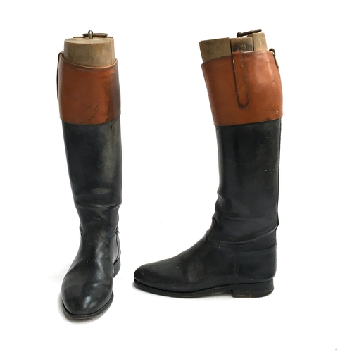 578 - A pair of black leather hunting boots with mahogany tops, with wooden trees, approx. size 9.5