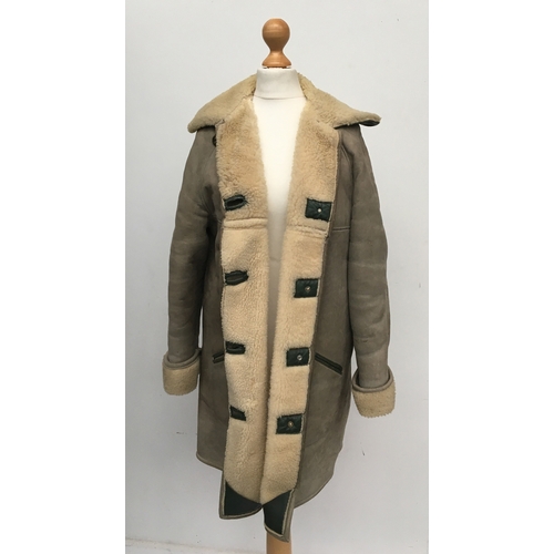 626 - A sheepskin and green leather coat