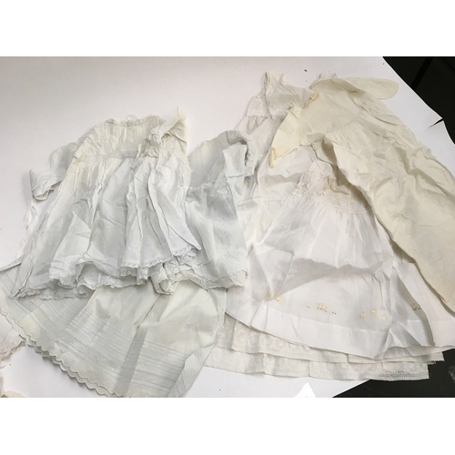 480 - A large quantity of christening gowns, some early