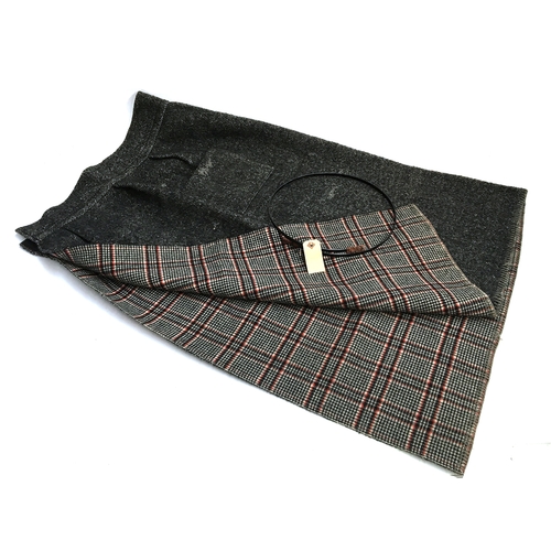 486 - An early 20th century tweed carriage driving skirt 'The Lindsell Rug', with steel waistband