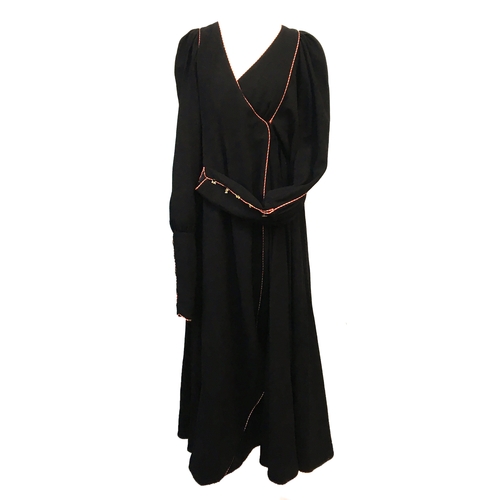 533 - A Bill Gibb of London black wraparound kaftan style dress, the long cuffs each with five enamel bees... 