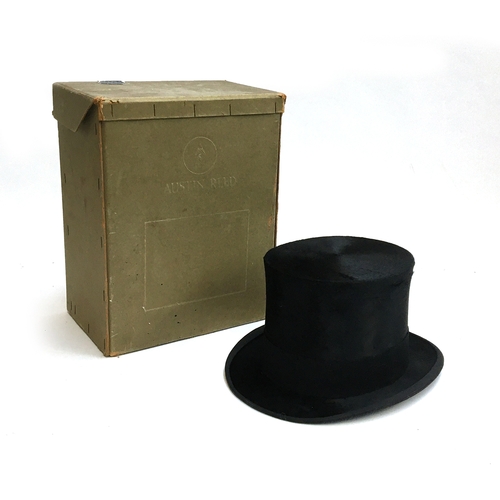 549 - An Austin Reed black silk top hat, approx. size 7, in original cardboard box