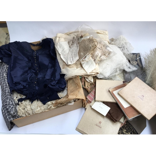 494 - A collection of 19th century lace, antique fabrics and ostrich feathers, three boxes of silk stockin... 